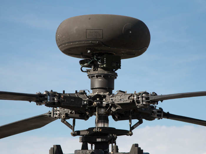 This is the radar dome atop the blades, which can detect the shapes of ground forces and other aircraft. The radar feeds that information into the cockpit displays.