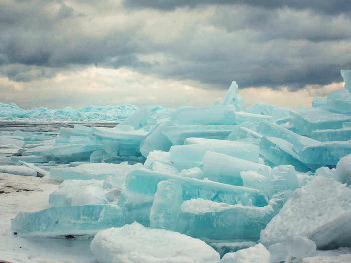 At the north and south poles, where glacier ice slowly slides down towards the oceans, air often gets squeezed out of the ice, making it really dense like this.