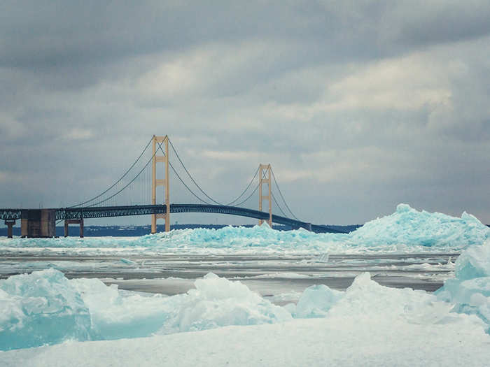 In Michigan, locals are marveling at the dense, blue, arctic-style ice cropping up on the shores of the Great Lakes.