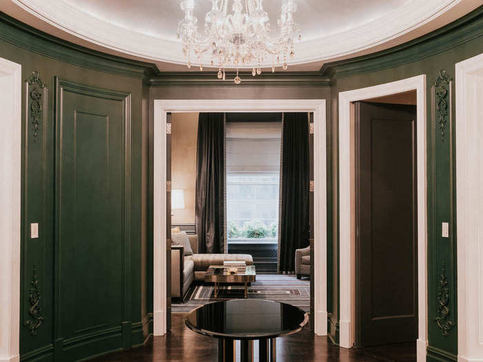 The vestibule reminded me of a maze, with rooms and hallways extending out in each direction. To the right, the entrance to the suite. Straight ahead, the library. To the left, the living room and master bedroom. Behind, the gym and kitchen.