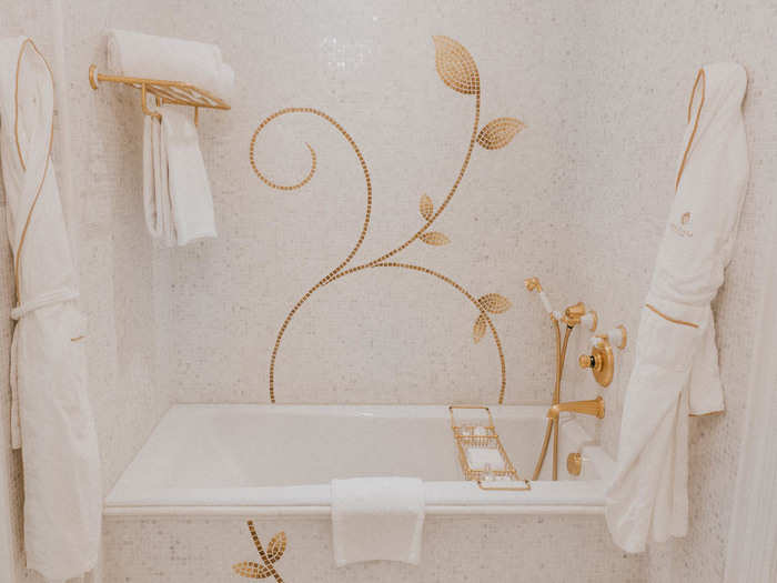 The gold mosaic tiling on the bathtub was my favorite part of the room. It