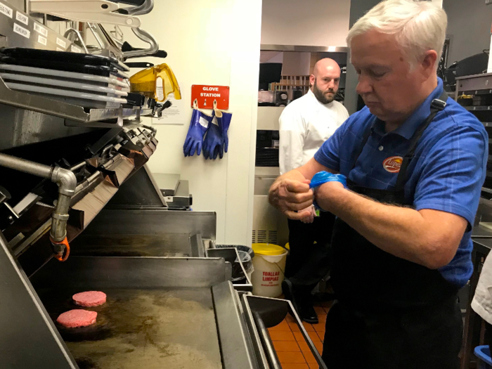 Beyond the gloves, however, the burger preparation is pretty much identical.