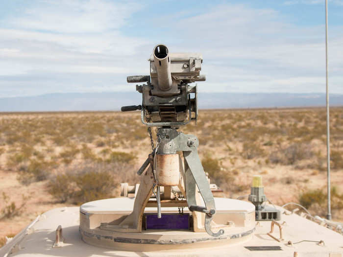 Mounted atop the ammunition supply vehicle is an MK19 automatic grenade launcher.