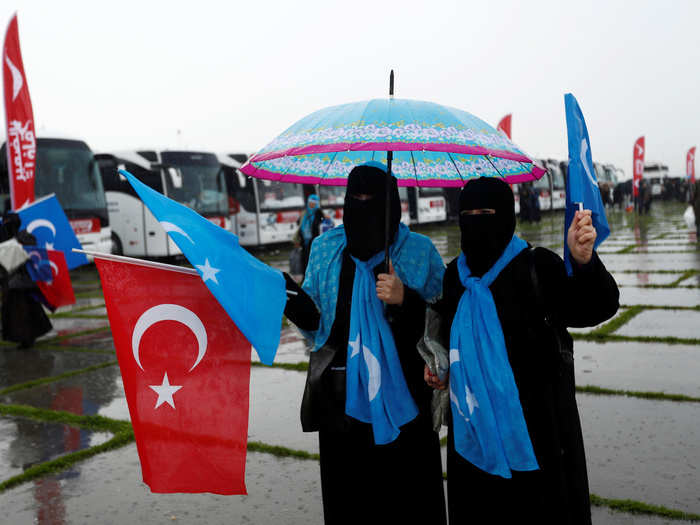 In Istanbul, there were all kinds of different celebrations of women. This pair took to the streets on Tuesday, waving Turkish and East Turkestan flags.