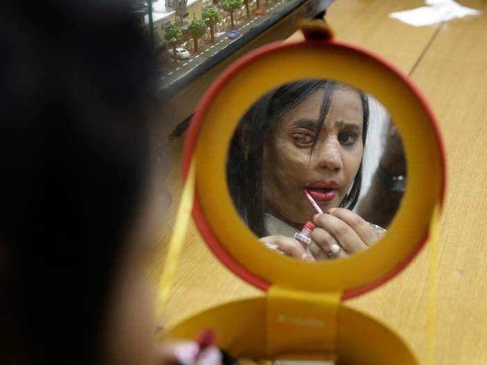 On the outskirts of Mumbai, this woman got ready for a fashion show aimed at stopping acid sales in the country.