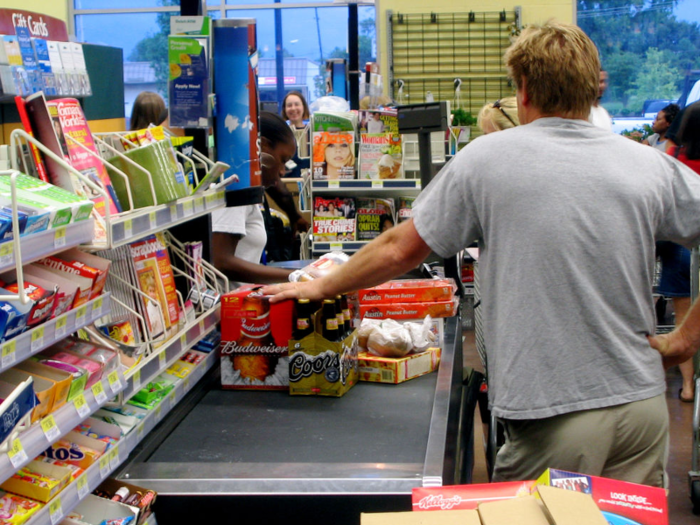 The checkout aisle is stocked with tempting items.