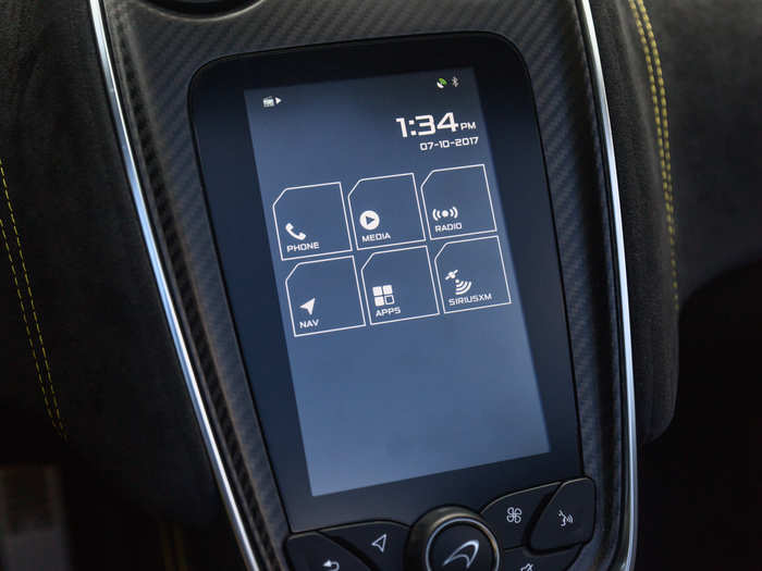 The center stack is equipped with a vertically-oriented seven-inch touchscreen. It