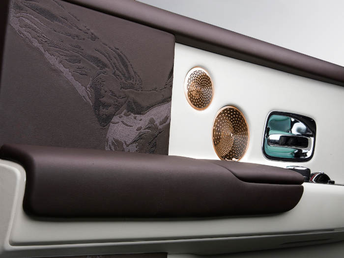 ...and there is a hand stitched Spirit of Ecstasy embroidery on the interior of the rear doors in addition to rose gold Bespoke Audio speakers.