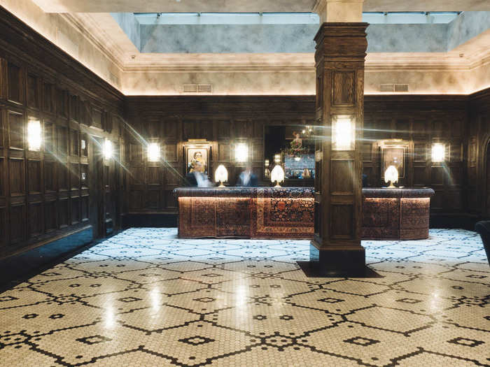 The lobby sets the scene of old meets new immediately. The tiling was chosen based on bits and pieces of the originals found throughout the development process. The carpeting on the lobby desk is from 1881, the same year the building was first constructed.