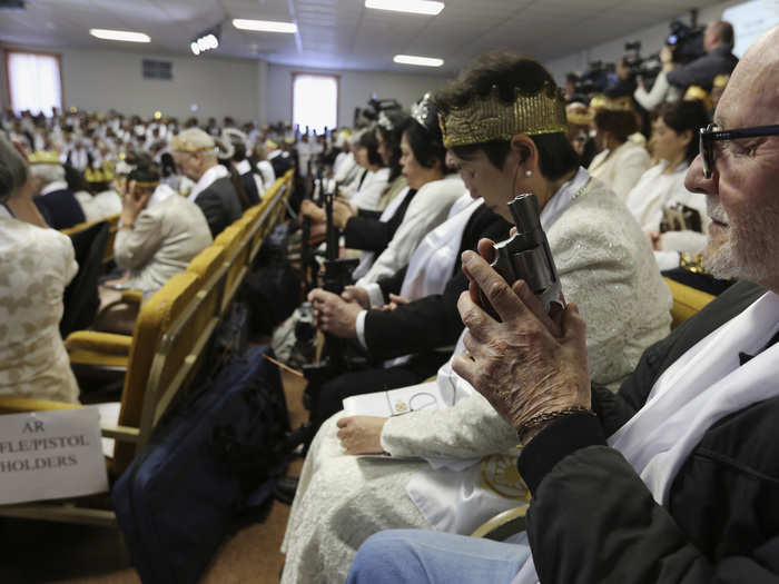 The event attracted a racially and culturally diverse array of followers. The service was held partly in Korean, and partly in English. Some wore tuxedos and gowns, while others were clad in jeans and NRA hats.