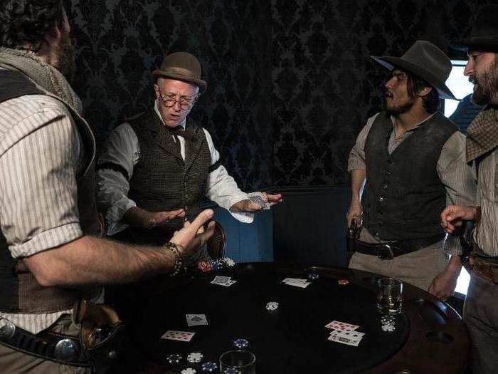 Guests were free to explore Sweetwater at their own pace. At the Mariposa Saloon, women dressed in corsets fawned over the guests, while cowboys played a heated card game.