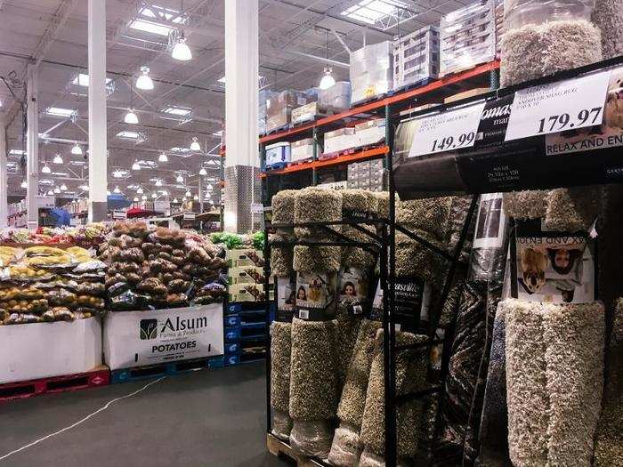 Everything at the store seemed to be randomly arranged. Rugs were in the middle of the produce aisle, and there was golfing equipment on the other side of this display. The middle of the store was cluttered with books and clothes ...