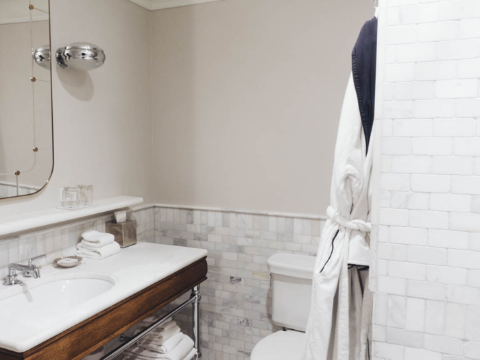 The bathroom at The Beekman, though done in marble and wood, is nothing to write home about. Like the room, it