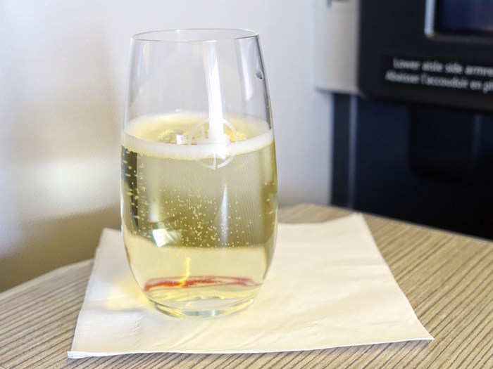 Upon seating, passengers are offered a welcome drink, like this glass of Champagne Honig opted for.