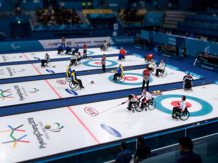 Wheelchair curling is a popular spectator sport at the 2018 Winter Paralympics, especially when all four sheets (lanes) are occupied.