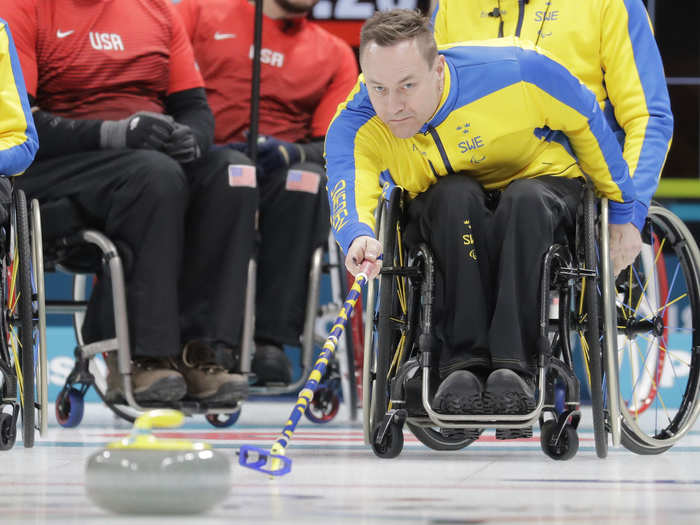 Ronny Persson of Sweden pushed the stone during a mixed wheelchair curling round session against the US.