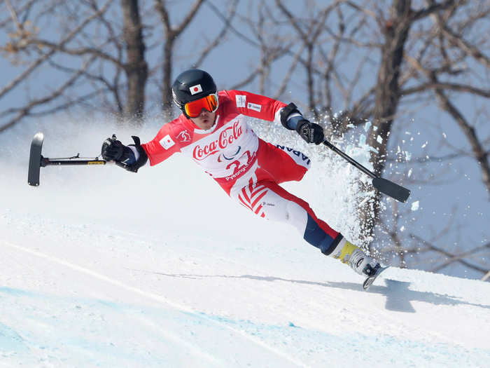 Hiraku Misawa of Japan sent the snow flying while competing in the men