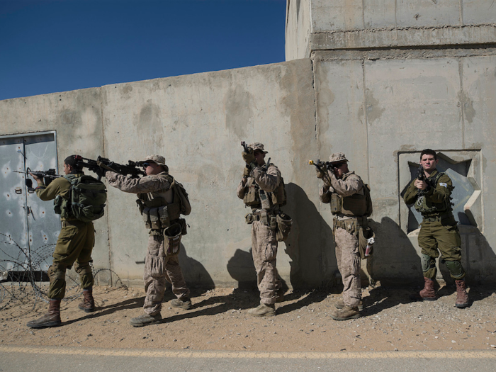 One of the first lessons of urban combat: be sure to watch the surrounding rooftops.