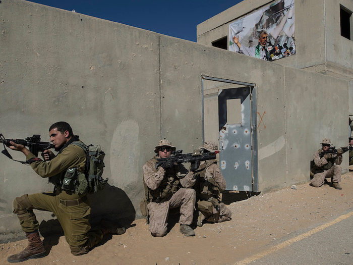 The mock village used in the exercise included Arabic graffiti and a mosque, and was made to look like an average Middle Eastern town.