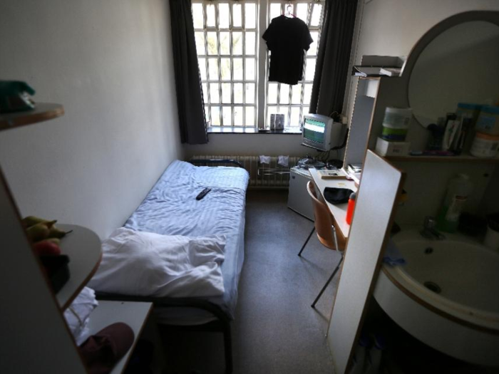 NETHERLANDS: Inmates at Norgerhaven prison in Veenhuizen have a bed, furniture, a refrigerator, and a TV in their cells, as well as a private bathroom. They also get a window with a view to the prison yard.