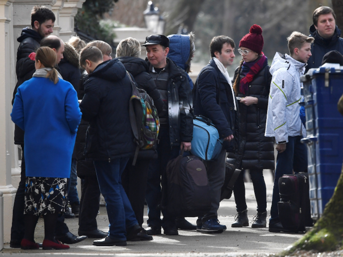 The embassy recently lost about 30% of its staff as Theresa May expelled 23 Russian diplomats from the UK over the Skripal case. There used to be 78 Russian officials; now there are 55. Here they are going home: