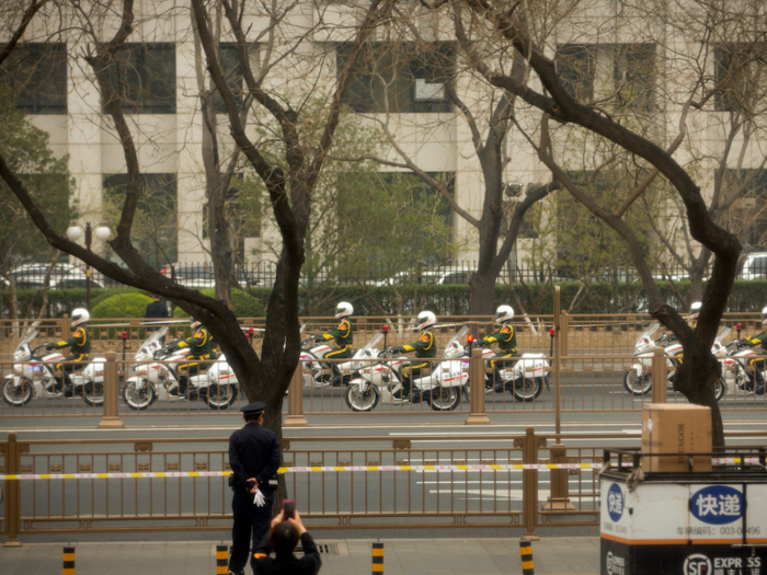 A motorcade of Chinese policemen on motorcycles escorted the mysterious vehicle along with others in a convoy in a similar fashion to state visits.