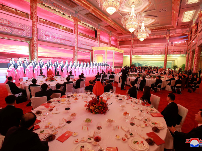 After the crockery was cleared and dessert was brought out, the lights appeared to turn red, and male and female performers, probably a choir, came out.