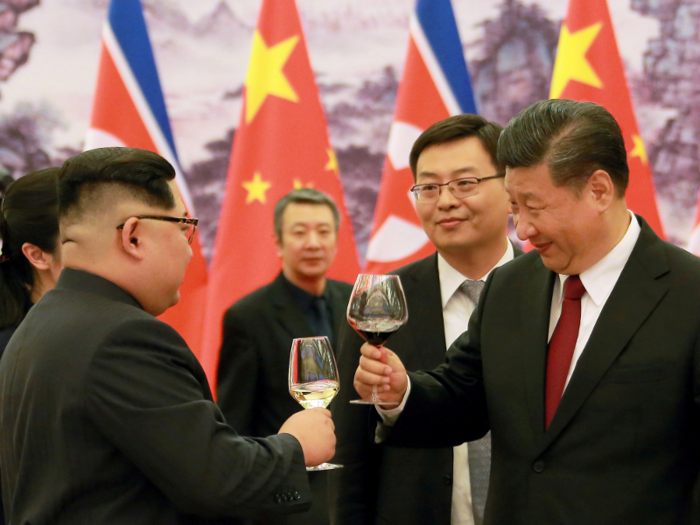 Kim and Xi also toasted each other at some point during the meal — Xi with red wine, and Kim with what looks like white wine.