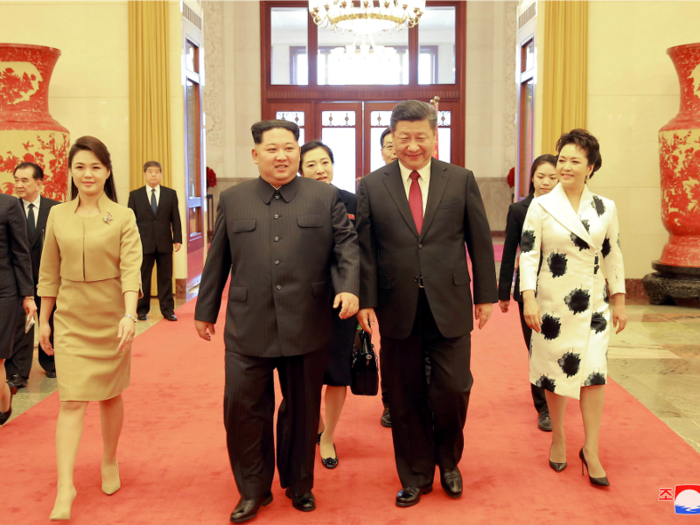 Xi Jinping and his wife, Peng Liyuan, greeted Kim and his wife, Ri Sol Ju. This was Kim