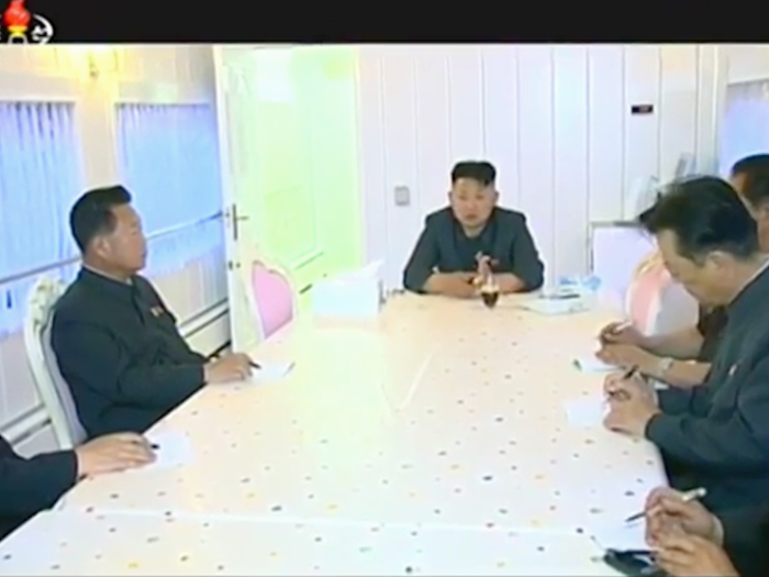 Kim Jong Un also conducts official business on the train. This still from a 2015 video shows Kim Jong Un speaking to officials in an all-white conference room during a domestic trip.