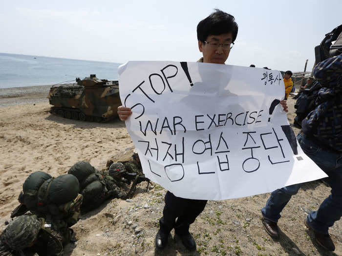 Some protestors manage to get up close and personal to the drills.