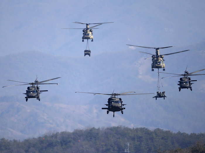 US Army CH-47 Chinook and Black Hawk helicopters take part in Foal Eagle at a training field in Pocheon, South Korea, March 25, 2015.