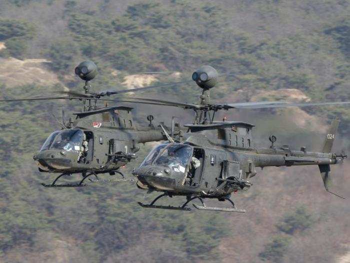 US Army OH-58D Kiowa Warrior helicopters fly during a combined arms live-fire exercise for Foal Eagle at the Rodriquez Multi-Purpose Range Complex in Pocheon, South Korea, March 25, 2015.