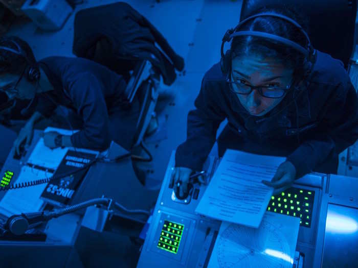 US Navy sonar technicians from the sonar central room of Arleigh Burke-class guided-missile destroyer USS Barry monitor ship bearings for contact during Foal Eagle, March 21, 2017.