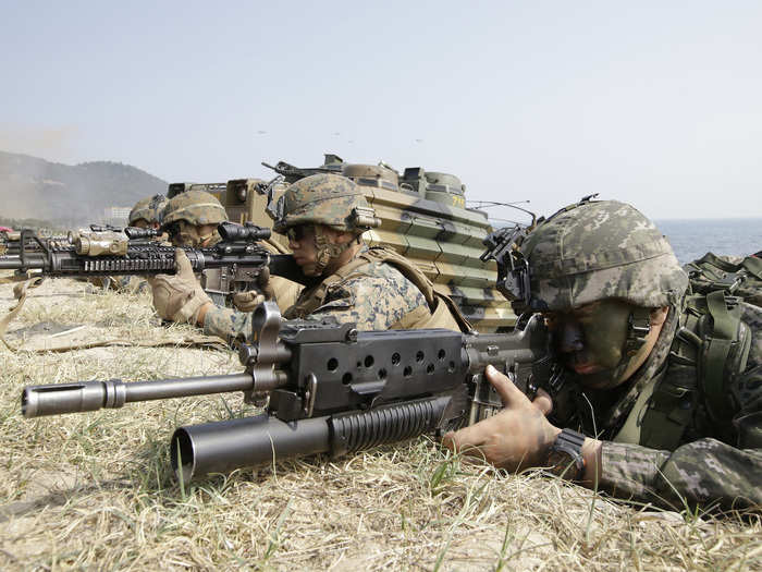 US and South Korean Marines aim their rifles near their amphibious assault vehicles during Foal Eagle, March 30, 2015.