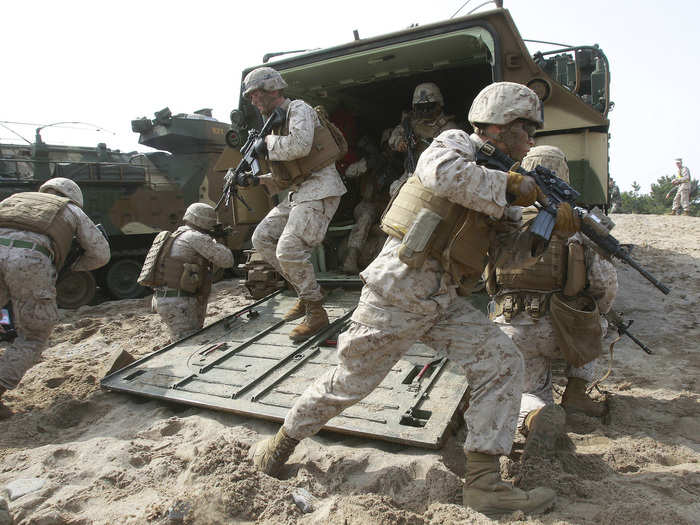 US Marines also train in South Korean vehicles. Here, US Marines run out from a South Korean LVT-7 during a joint landing exercise for Foal Eagle, in Pohang, South Korea, March 31, 2014.