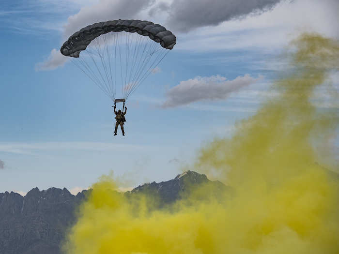 Eventually floating through the yellow smoke, which indicates the landing zone.