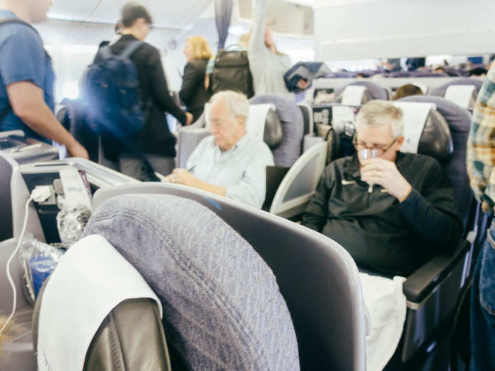 They were already seated, sipping cocktails and reading the newspaper. What luxury! I then had to walk past the other various seat classes before finding my way to the back.