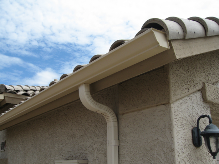 Eavestrough: A rain gutter. An eave is the part of a roof that extends over the walls of a building.