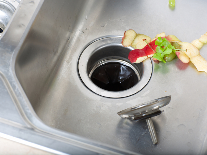 Garburator: An electric device underneath of a kitchen sink that breaks up food so it can be washed away. Americans call it a trash or garbage disposal.