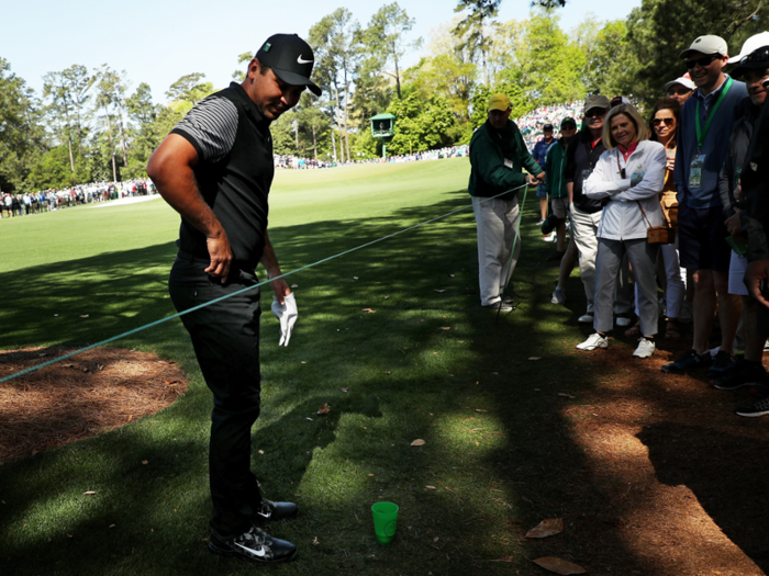 Jason Day had an interesting first round, with his tee shot landing in a patrons drink, leaving him to consult with a rules official on how to proceed.