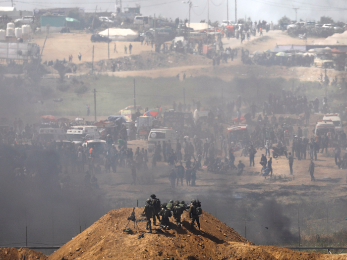 Israeli officials believe that Hamas is trying to "open up the fence and then to insert terrorists into Israel." Israel claims it has killed multiple Hamas gunmen in the protests, and says it will continue to guard the border until Hamas disarms.