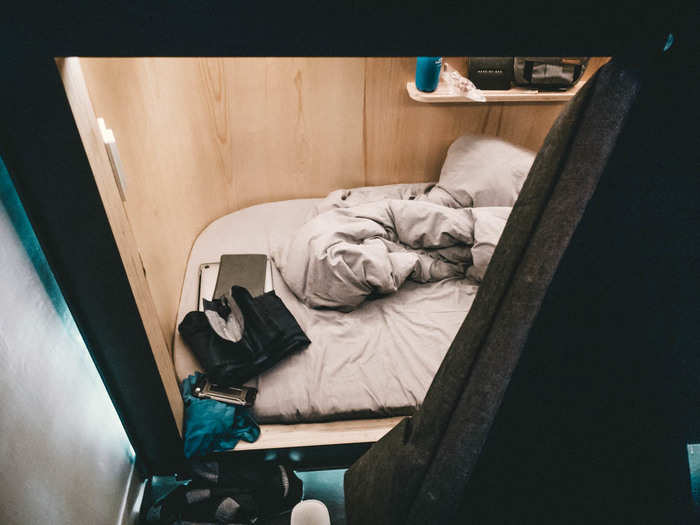 After brushing my teeth, I got set up for bed. I threw my Kindle, my phone, my laptop, and my water bottle into my "SLPer." It was all very snug and, in a way, cozy. A magnetic felt curtain opens and closes the pod.