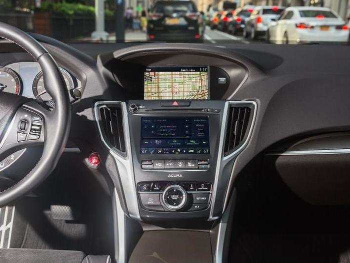 The system now features Apple CarPlay and Android Auto integration which appears on the top screen. It