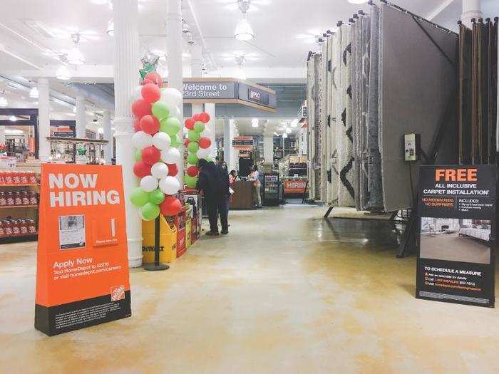 The store felt like a warehouse when I walked in, with high ceilings, industrial lighting, and a lot of open space. On the left were small household items like dish soap and cleaning supplies. To the right was the start of the flooring department.