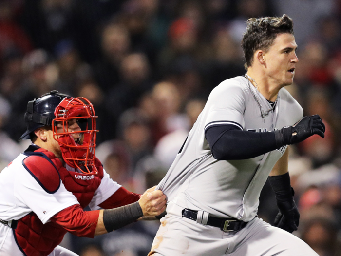 Red Sox catcher Christian Vazquez did his best to hold Austin back, but he escaped to meet Joe Kelly in the center of the diamond.