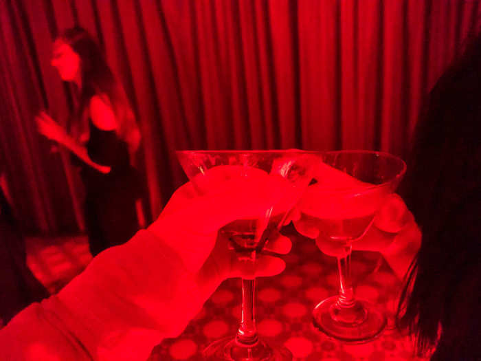 The party was, of course, open bar. I grabbed a couple of drinks for myself and my date and clinked glasses to what we hoped would be a wild night.