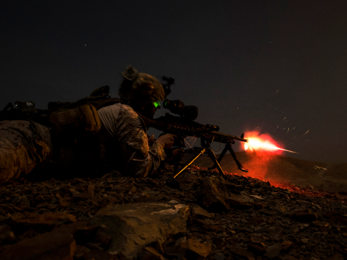 A Marine from the 13th Marine Expeditionary Unit, provides cover fire during a platoon assault exercise at Arta Range, Djibouti.