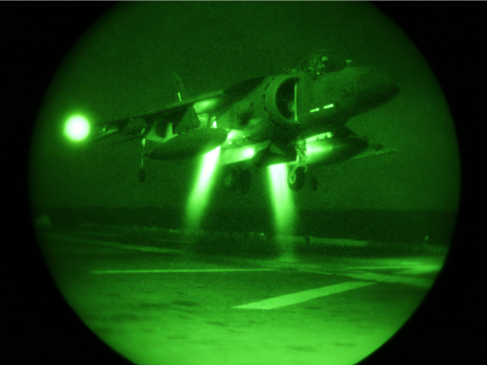 An AV-8B Harrier with Marine Attack Squadron 311, part of the Air Combat Element of the 31st Marine Expeditionary Unit, lands on the USS Essex (LHD 2), March 6. The pilots of VMA 311 were conducting night carrier landing qualifications in preparation for the 31st MEU