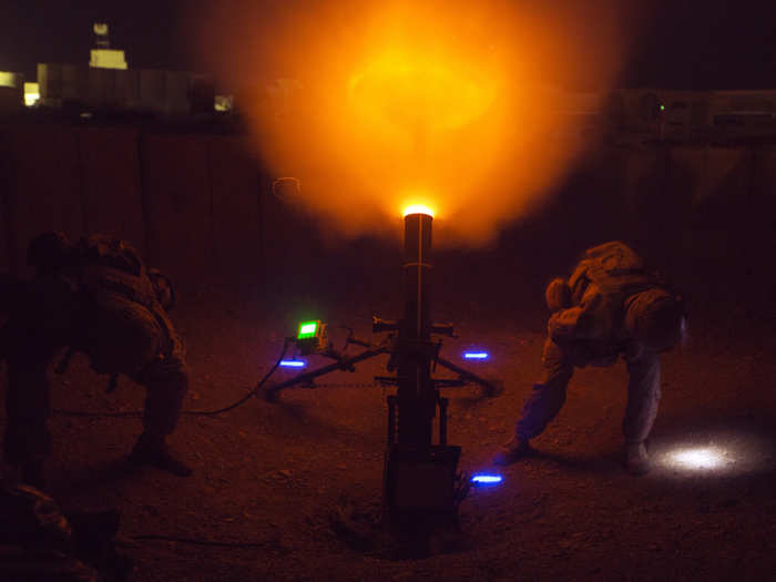 US Marines with Task Force Southwest (TFSW) fire a 120mm mortar as a show of force at Camp Shorab, Afghanistan.